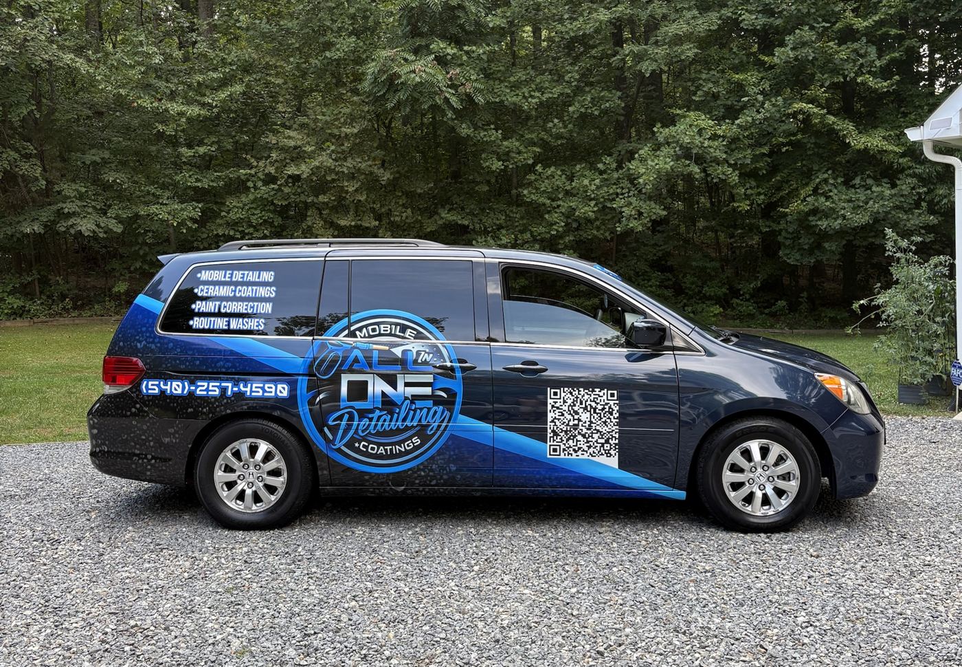 The All-In-One Mobile Detailing and Coatings van with its blue wrap